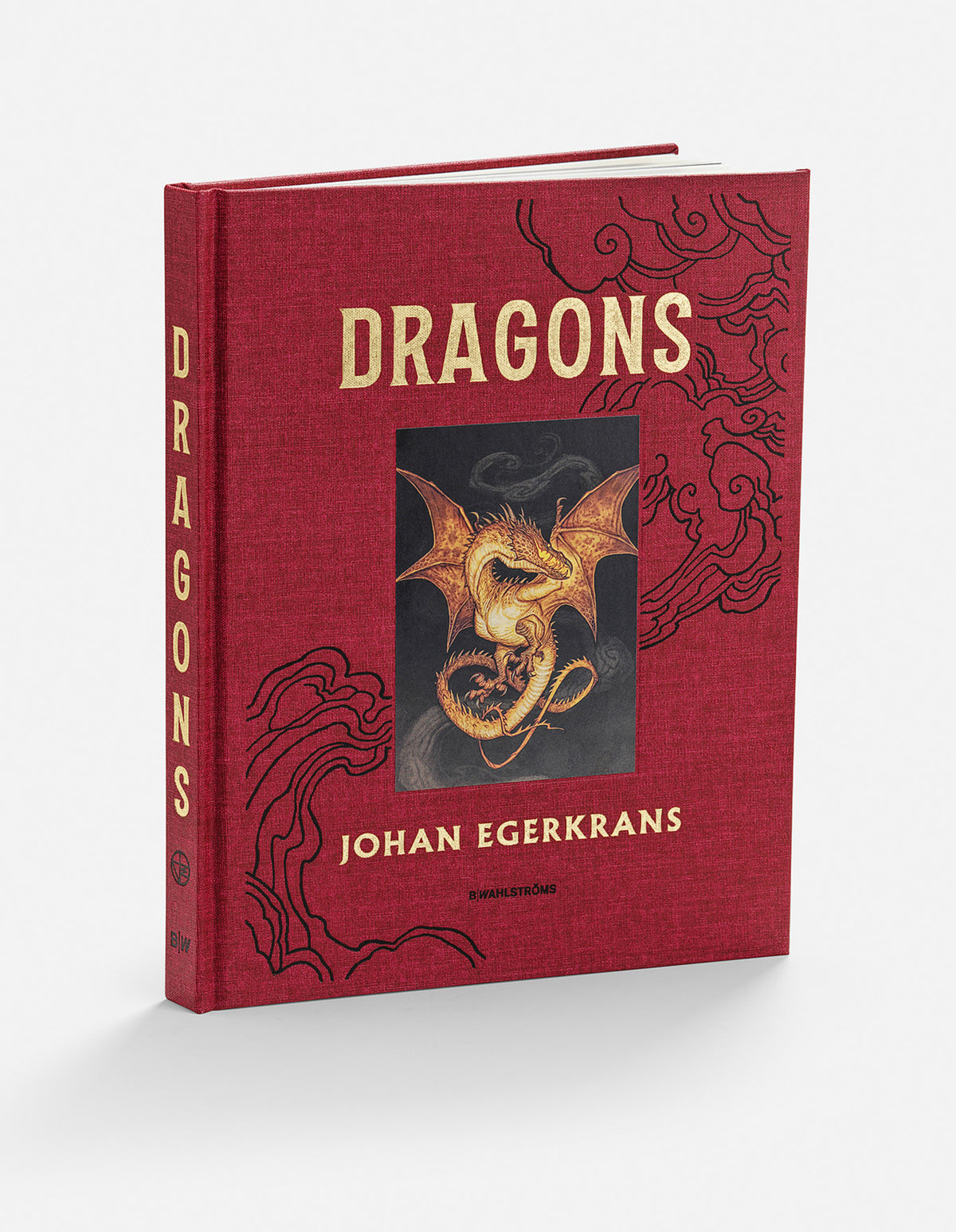 Dragons hardcover in red cloth with black cloud motifs and a golden winged dragon on the cover.